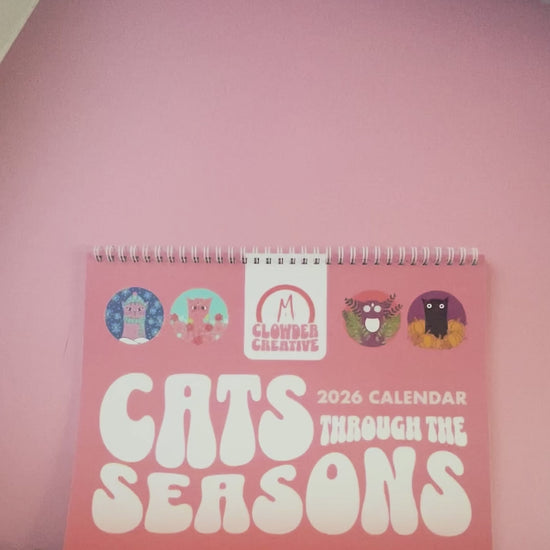 Video flipping through 2026 Cats Through the Seasons Calendar